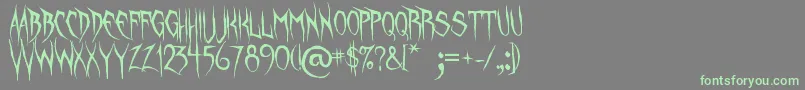 UnquietSpirits-Schriftart – Grüne Schriften auf grauem Hintergrund