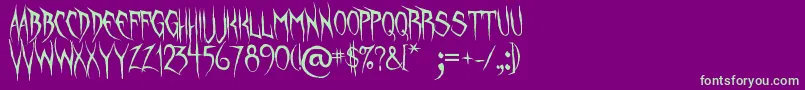 フォントUnquietSpirits – 紫の背景に緑のフォント