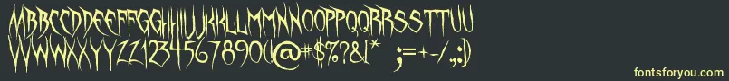 UnquietSpirits Font – Yellow Fonts on Black Background