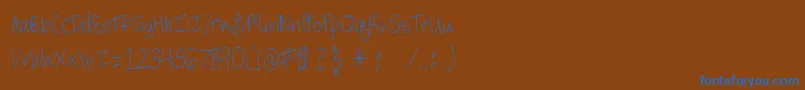 ThirdGradeHandwriting-Schriftart – Blaue Schriften auf braunem Hintergrund