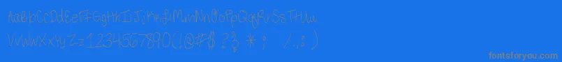 ThirdGradeHandwriting-Schriftart – Graue Schriften auf blauem Hintergrund