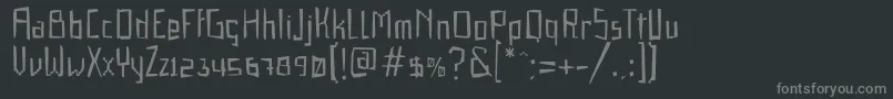 フォントGabardinaRegular – 黒い背景に灰色の文字