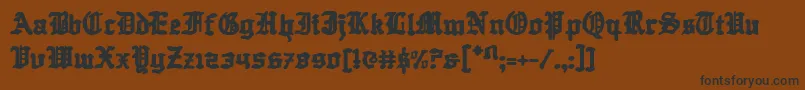 フォントQuestknight – 黒い文字が茶色の背景にあります