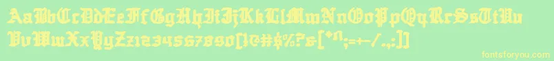 フォントQuestknight – 黄色の文字が緑の背景にあります