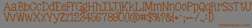 Шрифт Kgbestillandknow – коричневые шрифты на сером фоне
