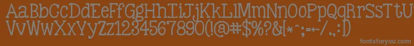 Kgbestillandknow-Schriftart – Graue Schriften auf braunem Hintergrund