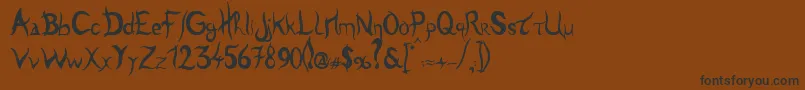 Tulen-Schriftart – Schwarze Schriften auf braunem Hintergrund