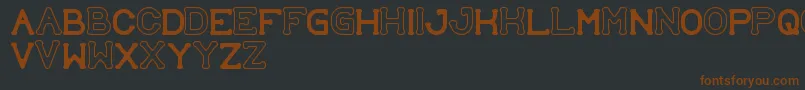 Шрифт SubmitToFaith – коричневые шрифты на чёрном фоне