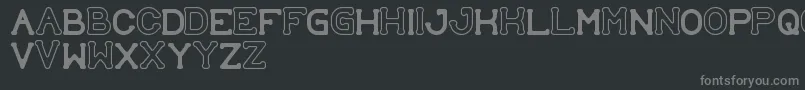 フォントSubmitToFaith – 黒い背景に灰色の文字