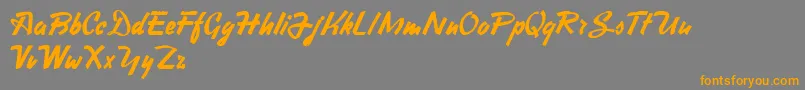 フォントHeavySquaredWriting – オレンジの文字は灰色の背景にあります。
