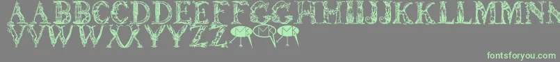 Lettersanimales-Schriftart – Grüne Schriften auf grauem Hintergrund