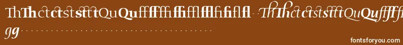 Fonte OldstyleflourishesRegular – fontes brancas em um fundo marrom