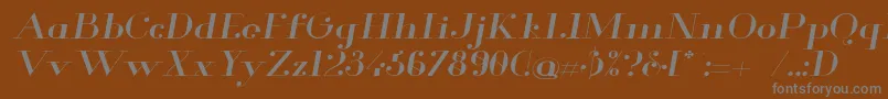 Glamor Extendeditalic-fontti – harmaat kirjasimet ruskealla taustalla