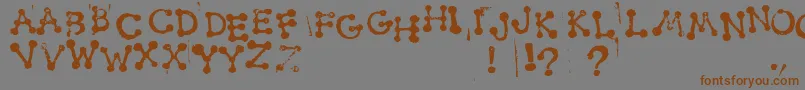 SmudgyDotStamps Font – Brown Fonts on Gray Background