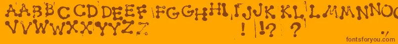 SmudgyDotStamps Font – Brown Fonts on Orange Background