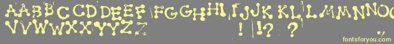 SmudgyDotStamps Font – Yellow Fonts on Gray Background