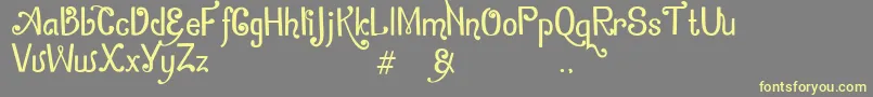 ZamrudKhatulistiwa Font – Yellow Fonts on Gray Background