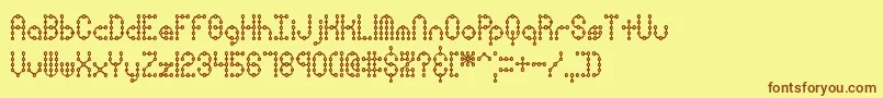 PindownXPlainBrk Font – Brown Fonts on Yellow Background