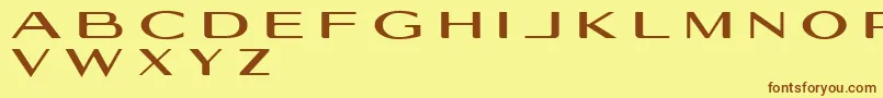 フォントGeogiquas – 茶色の文字が黄色の背景にあります。