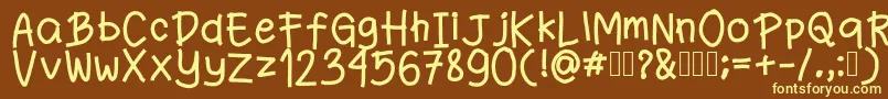 Fanande-fontti – keltaiset fontit ruskealla taustalla
