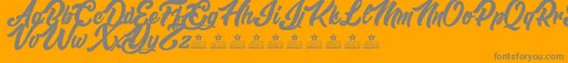 MasterOfComicsPersonalUse-fontti – harmaat kirjasimet oranssilla taustalla