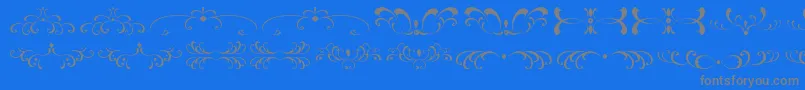 Шрифт FiligreesAndOrnamentsSt – серые шрифты на синем фоне