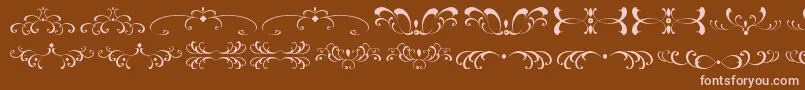 Шрифт FiligreesAndOrnamentsSt – розовые шрифты на коричневом фоне