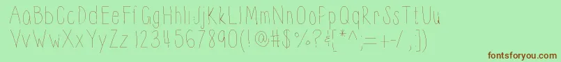 フォントThinnyness – 緑の背景に茶色のフォント
