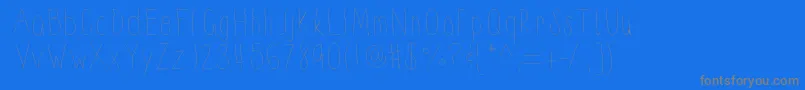 Thinnyness-fontti – harmaat kirjasimet sinisellä taustalla
