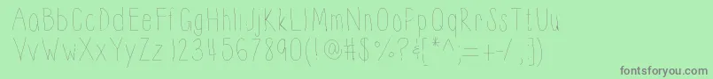 Thinnyness-Schriftart – Graue Schriften auf grünem Hintergrund