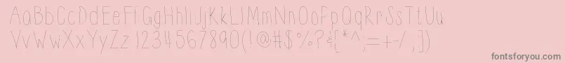 Thinnyness-fontti – harmaat kirjasimet vaaleanpunaisella taustalla
