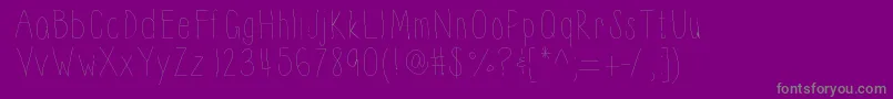 Thinnyness-fontti – harmaat kirjasimet violetilla taustalla