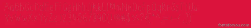 Thinnyness-fontti – harmaat kirjasimet punaisella taustalla