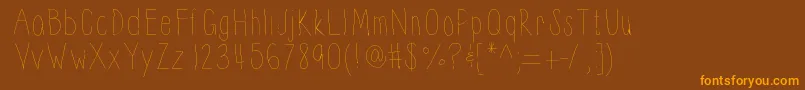 フォントThinnyness – オレンジ色の文字が茶色の背景にあります。