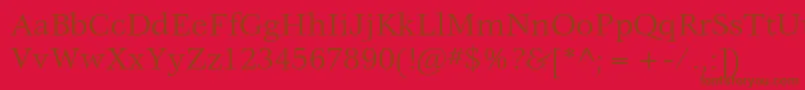 VeljovicstdBook-Schriftart – Braune Schriften auf rotem Hintergrund
