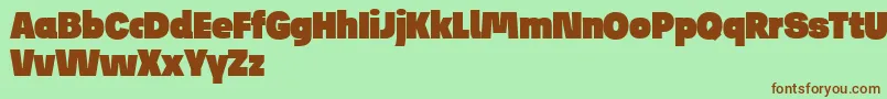 Czcionka JosefReducedUltra – brązowe czcionki na zielonym tle