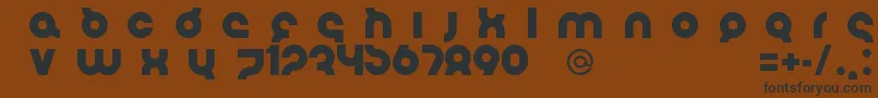 フォントFlirtBoboBold – 黒い文字が茶色の背景にあります