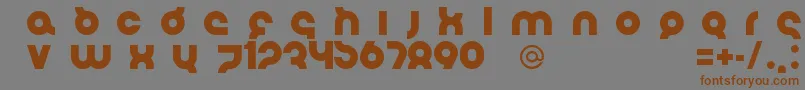 フォントFlirtBoboBold – 茶色の文字が灰色の背景にあります。