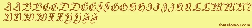 フォントThannhaeuserzier – 茶色の文字が黄色の背景にあります。