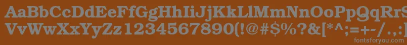BookwomanDemish-fontti – harmaat kirjasimet ruskealla taustalla