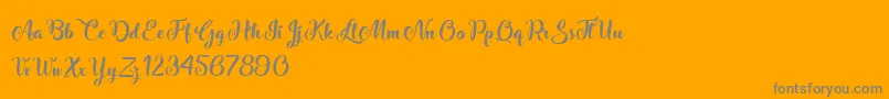 StardustAdventure-Schriftart – Graue Schriften auf orangefarbenem Hintergrund