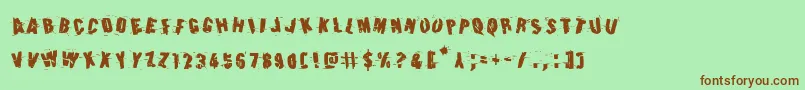 Earthshakerotate Font – Brown Fonts on Green Background