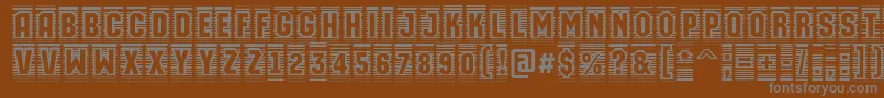 フォントAMachinaortocmln – 茶色の背景に灰色の文字