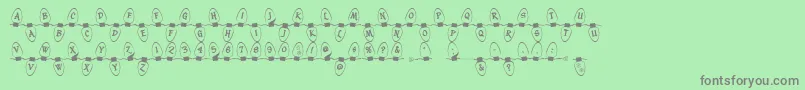 Christmaslightsoutdoor Font – Gray Fonts on Green Background