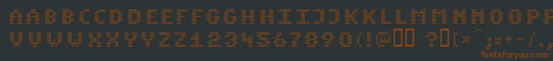 Fonte KomodoreNormal – fontes marrons em um fundo preto