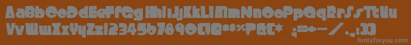 フォントCrystalradiokitink – 茶色の背景に灰色の文字