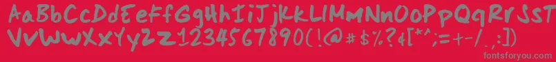 ScoderHand-Schriftart – Graue Schriften auf rotem Hintergrund