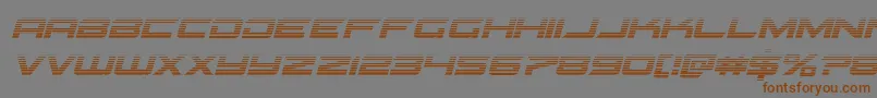 フォントGypsykillergradital – 茶色の文字が灰色の背景にあります。