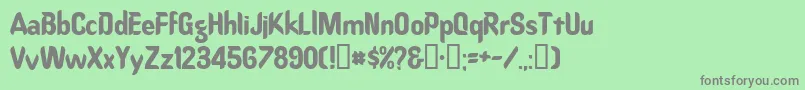 Oregondry-fontti – harmaat kirjasimet vihreällä taustalla