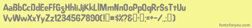 Oregondry-fontti – harmaat kirjasimet keltaisella taustalla
